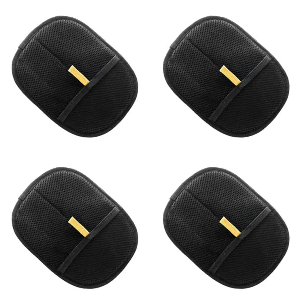 Set of four black pet grooming gloves with textured mesh surface and yellow tags