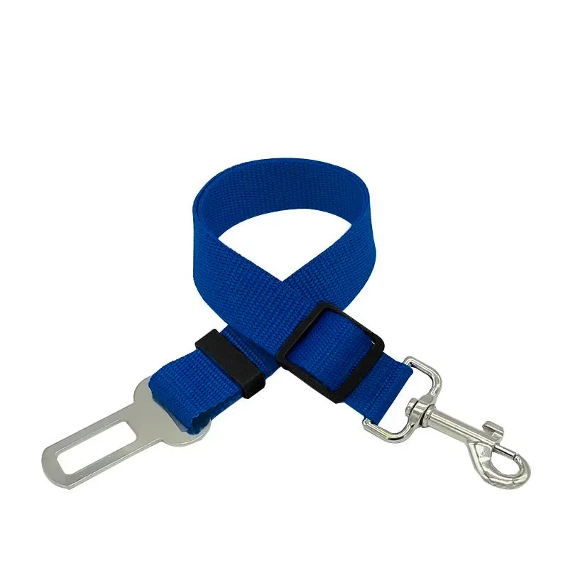 Blue adjustable pet seat belt with metal clip and car buckle attachment on white background