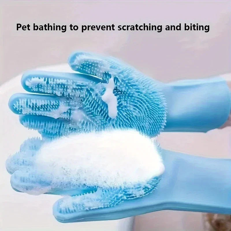 Blue silicone grooming gloves with bristles and soap suds for pet bathing and cleaning