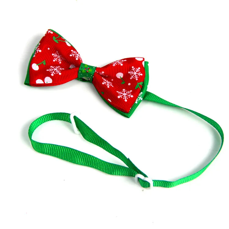 Adjustable SnuggleNest™ Christmas bow tie collar for dogs and cats with festive holiday design.