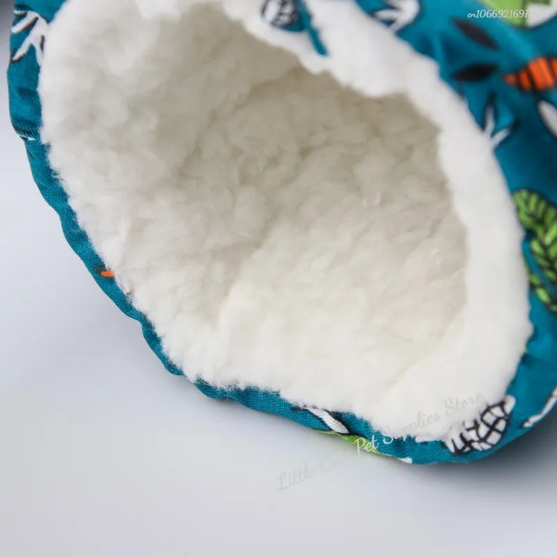 Arctic-Guard small pet bed in heat-retaining velvet, featuring a cozy nesting pod design for ultimate comfort.