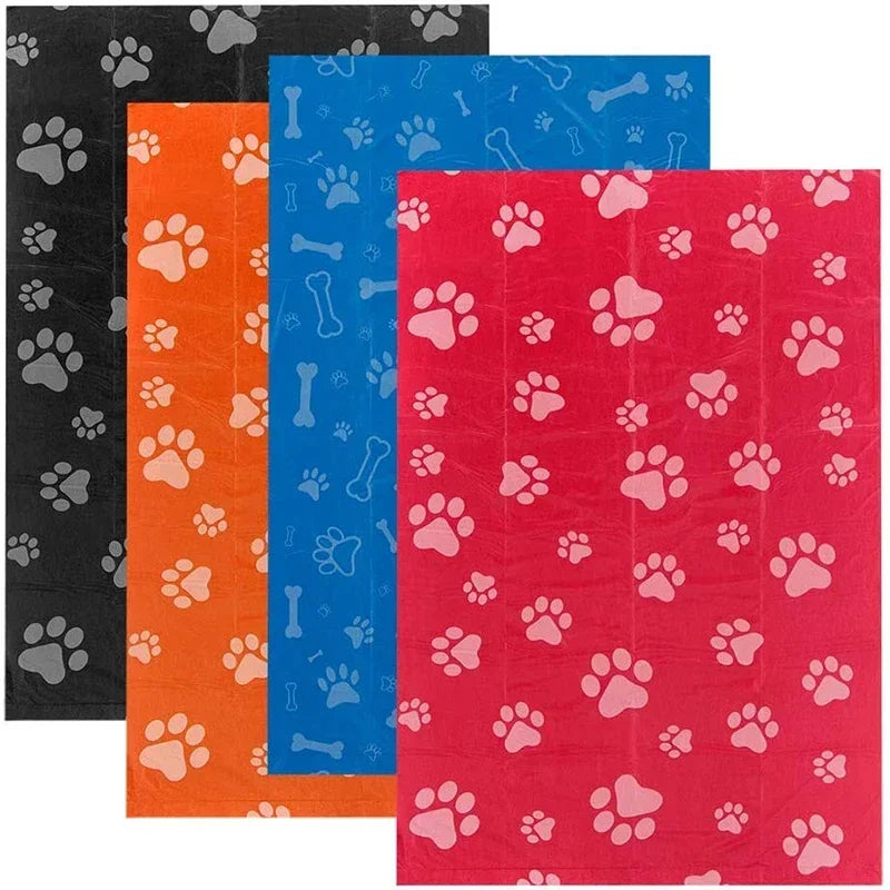 Colorful pet pads with paw print patterns in black, orange, blue, and red for dogs or cats