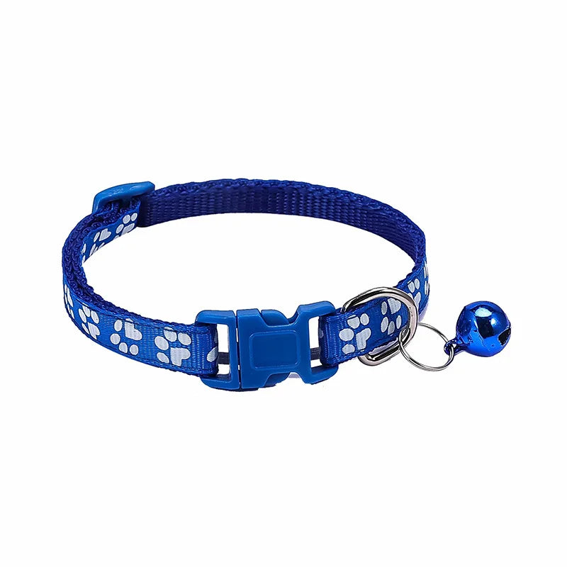 Colorful PawGuard™ pet collar with bell featuring cartoon footprints, adjustable design for dogs and cats.