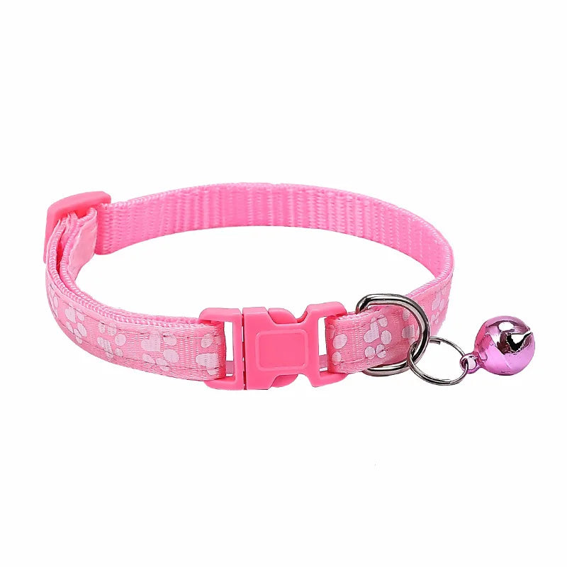 Colorful PawGuard™ pet collar with bell featuring cartoon footprints, adjustable design for dogs and cats.