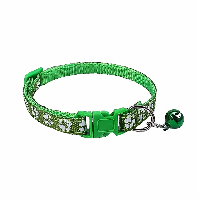 Colorful PawGuard™ pet collar with bell featuring cartoon footprints, adjustable for dogs and cats.