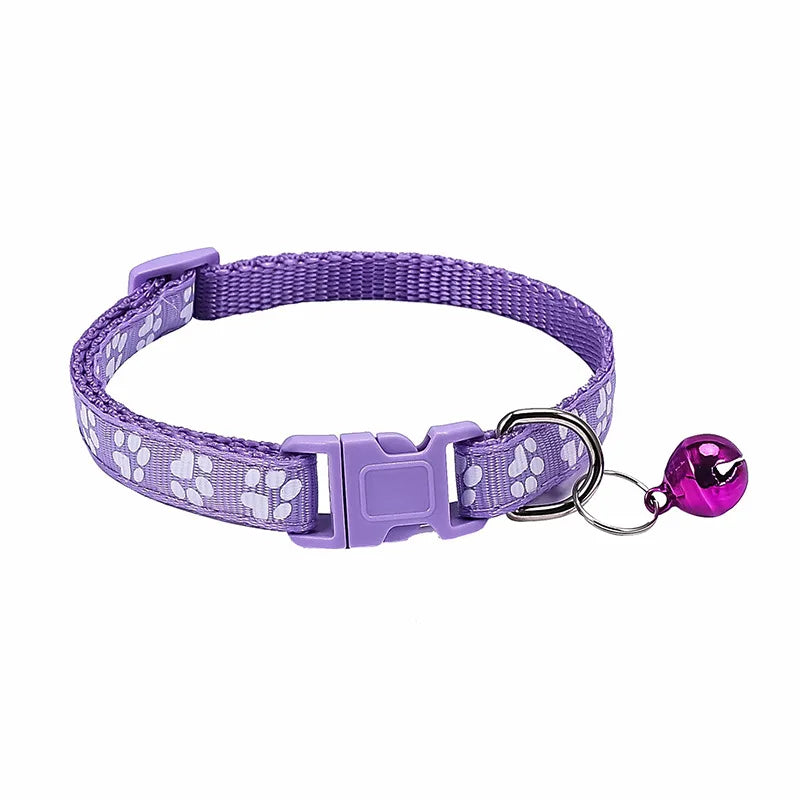 Colorful PawGuard™ pet collar with bell featuring cartoon footprints, adjustable design for dogs and cats.