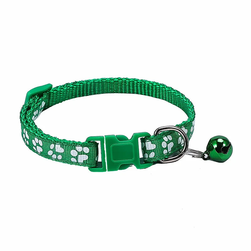 Colorful PawGuard™ pet collar with bell, featuring cartoon footprints, adjustable design for dogs and cats.