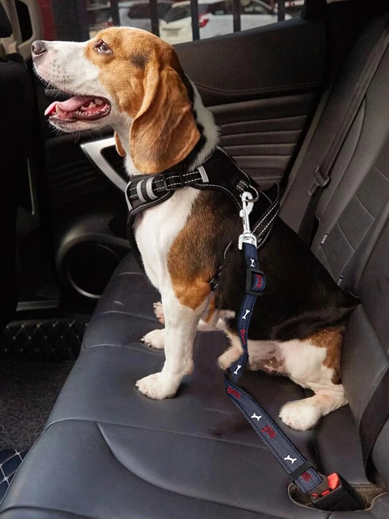 Adjustable denim dog car seat belt with metal buckle, designed for all sizes of retractable pet safety harnesses.