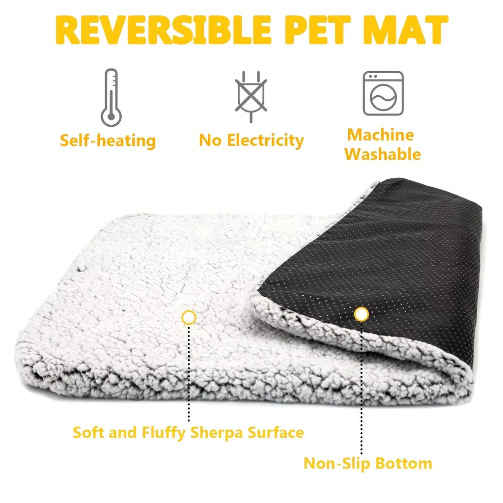 Reversible self-heating pet mat with soft sherpa surface and non-slip bottom, machine washable.