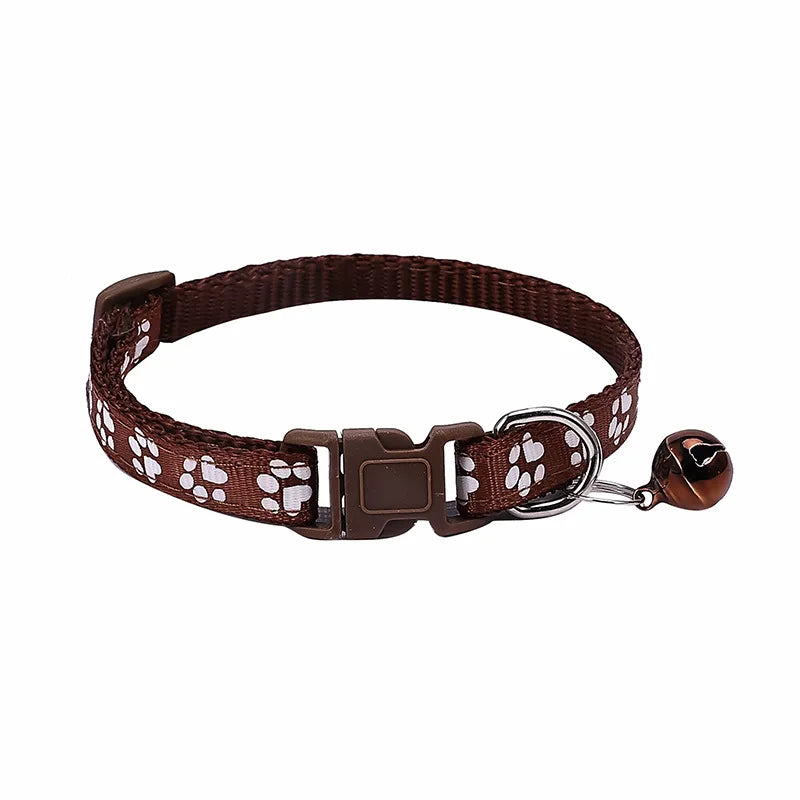 Colorful PawGuard™ pet collar with bell, featuring cartoon footprints, adjustable design for dogs and cats.