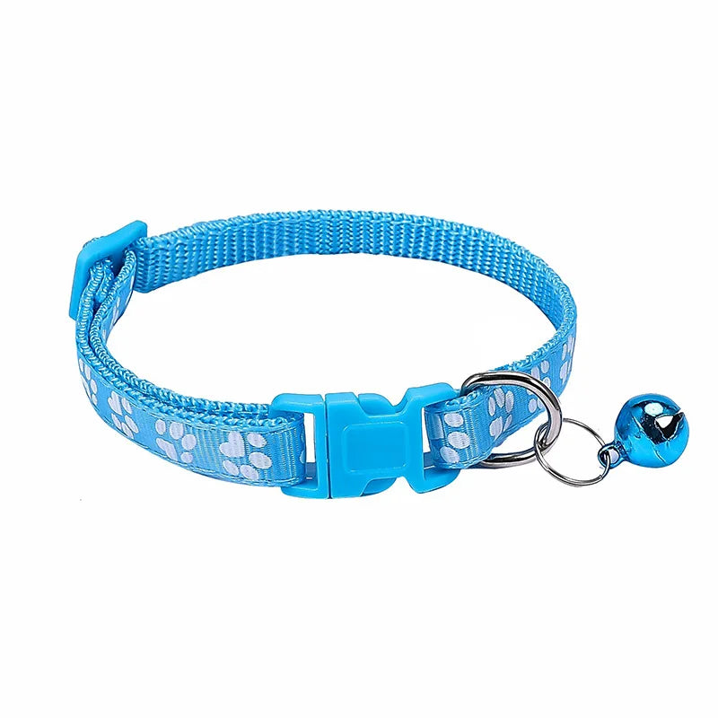 Colorful PawGuard™ pet collar with bell featuring cartoon footprints, adjustable design for dogs and cats.