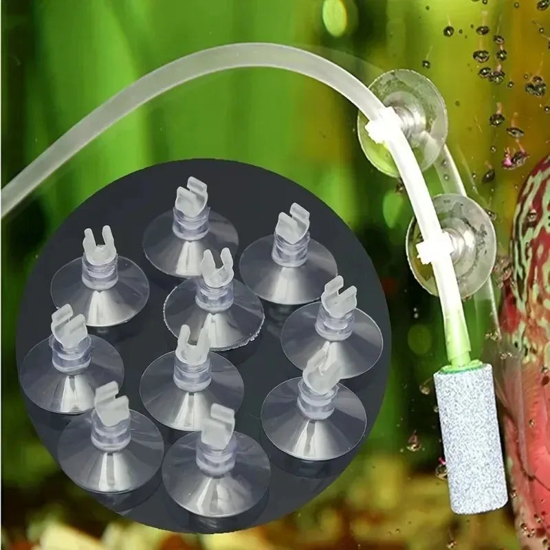 Clear AquaGrip™ suction cup clips for aquarium air line tubes, showing multiple clips in a neat arrangement.