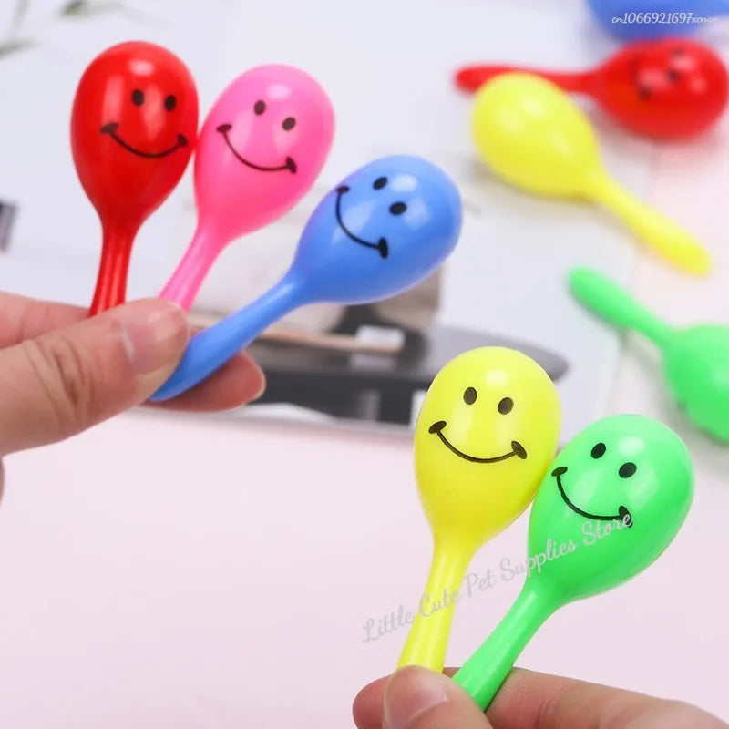 Colorful BeakBright™ parrot sand rattle toys in a pack, designed for interactive beak grinding and training for birds.