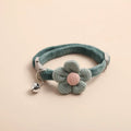 Adjustable SoftHaven™ pet collar with a bowknot design and bell for dogs, made from soft cotton fabric.