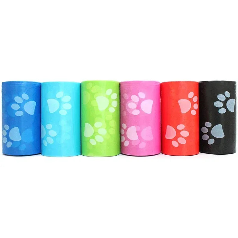 Colorful pet waste bag rolls with paw print design, assorted blue, green, pink, red, and black