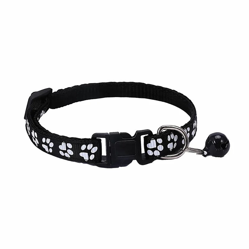Colorful PawGuard™ pet collar with bell, featuring cartoon footprints, adjustable for dogs and cats.