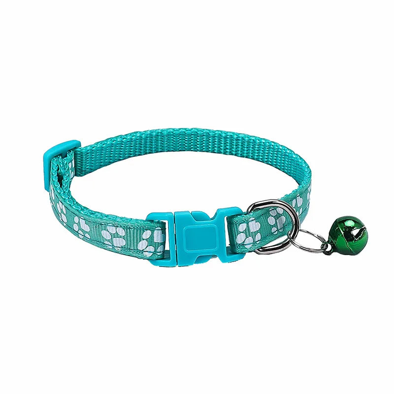 Colorful PawGuard™ pet collar with bell featuring cartoon footprints, adjustable design for dogs and cats.