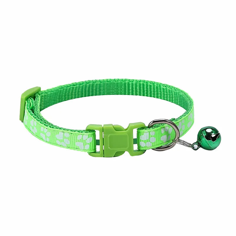 Colorful PawGuard™ pet collar with bell featuring cartoon footprints, adjustable design for dogs and cats.