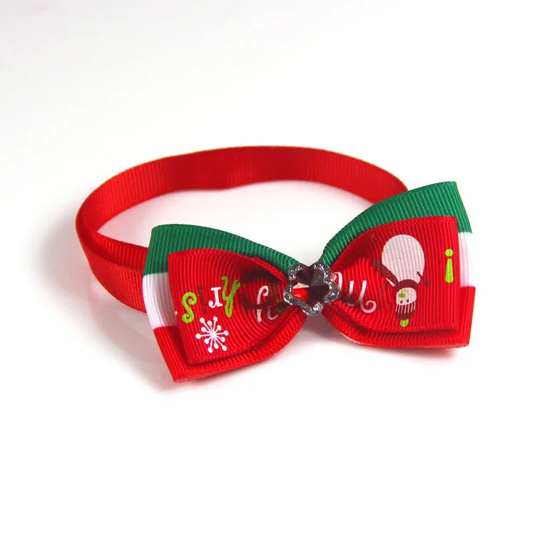 Adjustable SnuggleNest™ Christmas bow tie collar for dogs and cats, featuring festive colors and a classic design.