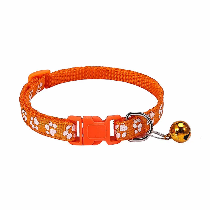 Colorful PawGuard™ pet collar with bell featuring cartoon footprints, adjustable design for dogs and cats.