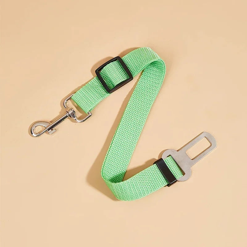 Green adjustable dog seat belt with metal clip and seatbelt buckle for pet car safety