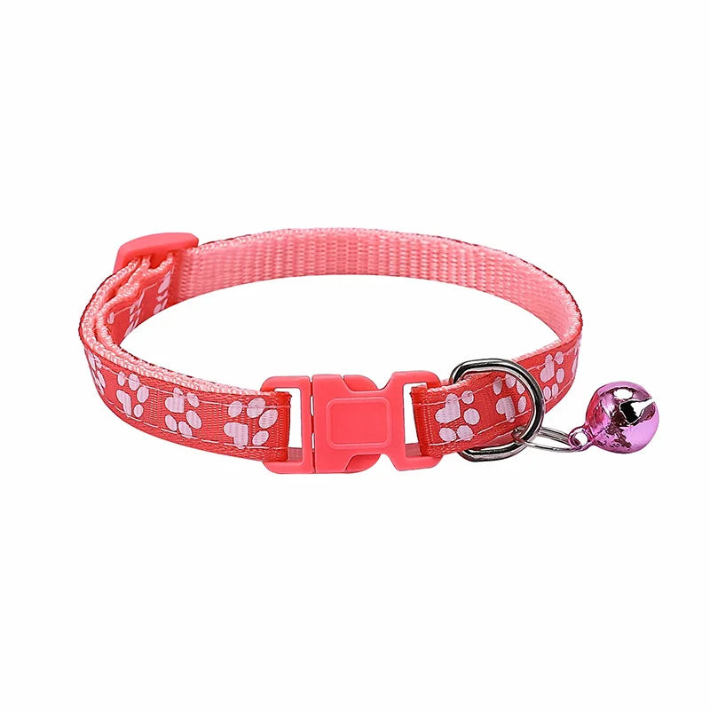 Colorful PawGuard™ pet collar with bell featuring cartoon footprints, adjustable design for dogs and cats.