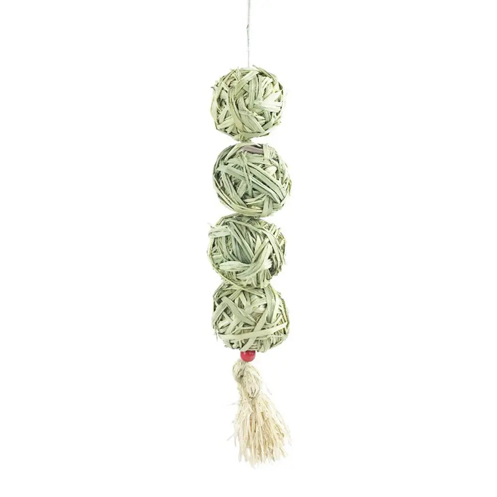 Natural grass chewing balls for pets by Petivo, showcasing their eco-friendly texture and vibrant green color.