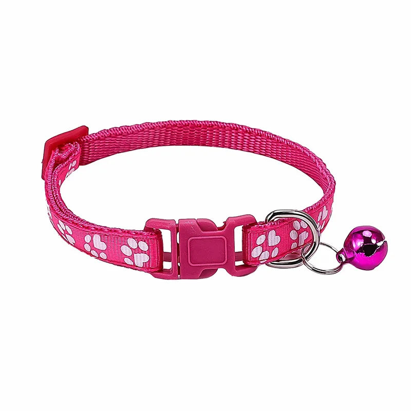 Colorful PawGuard™ pet collar with bell featuring cartoon footprints, adjustable design for dogs and cats.