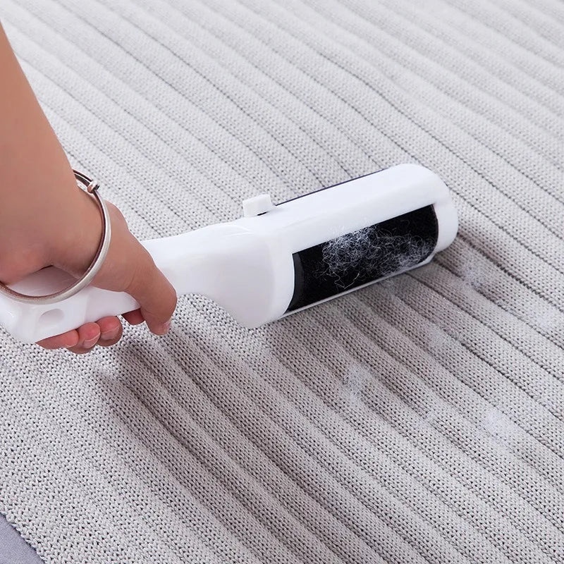 MagnaSpin™ 360° Electrostatic Fur Lifter, a rotating pet hair remover for clothing and upholstery in action.