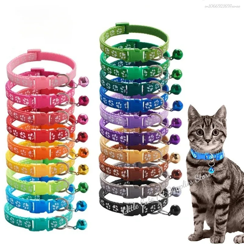 Colorful PawGuard™ pet collar with bell featuring cartoon footprints, adjustable design for dogs and cats.
